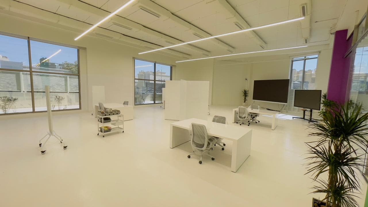 Modern office interior with large windows and contemporary furniture